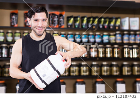 seller showing different sport nutrition 112187432