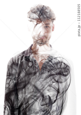 A full-front portrait of a man combined with swirling smoke in double exposure A full-front portrait of a man combined with swirling smoke in double exposure 112188505