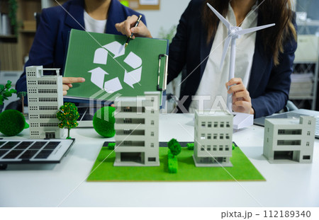 Businessman working virtual modern computer to reduce CO2 emissions carbon footprint climate change to limit global warming.Sustainable development and innovation green business concept. Businessman working virtual modern computer to reduce CO2 emissions carbon footprint climate change to limit global warming.Sustainable development and innovation green business concept. 112189340