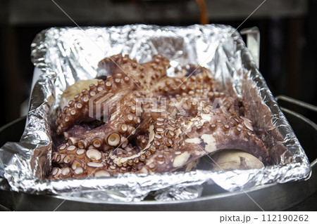 Detail of cooked octopus typical of Spain, typical and healthy food Detail of cooked octopus typical of Spain, typical and healthy food 112190262