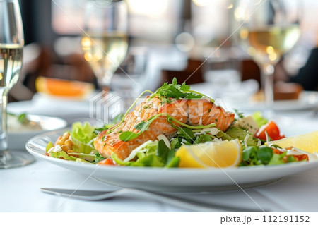 Dish cooked with salmon, vegetables and lemon 112191152