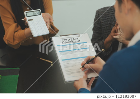 Team of architectures and businessmen discussing and brainstorming on floor plan modification for real estate investment and housing development project 112192087