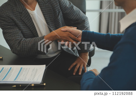 Team of architectures and businessmen discussing and brainstorming on floor plan modification for real estate investment and housing development project Team of architectures and businessmen discussing and brainstorming on floor plan modification for real estate investment and housing development project 112192088