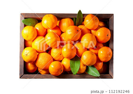 Group of ripe orange tangerines in a wooden box on a white background isolate 112192246