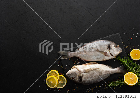 Dorada fish on a black background 112192913