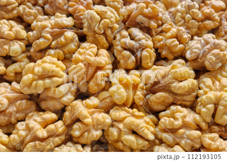 Close up photo of natural dried walnuts, selective focus, food background. Close up photo of natural dried walnuts, selective focus, food background. 112193105