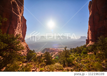 Sedona Red Rock Cliffs and Desert Vegetation under Blue Sky Sedona Red Rock Cliffs and Desert Vegetation under Blue Sky 112196109