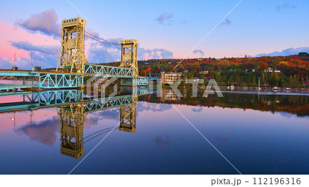 Aerial View of Portage Lake Lift Bridge at Sunrise with Autumn Foliage Aerial View of Portage Lake Lift Bridge at Sunrise with Autumn Foliage 112196316