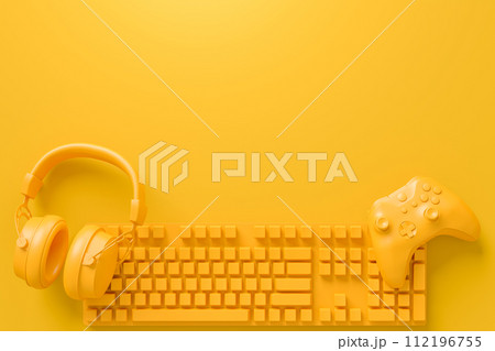 Modern home office setup featuring keyboard, gaming controllers and headphones Modern home office setup featuring keyboard, gaming controllers and headphones 112196755