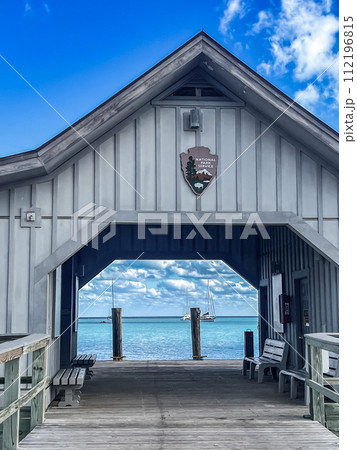 View through the boat dock at Dry Tortugas National Park with the North Atlantic and sail boats on the other side. View through the boat dock at Dry Tortugas National Park with the North Atlantic and sail boats on the other side. 112196815