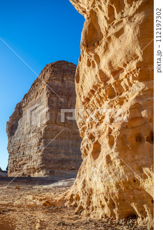 Sandstone elephant rock erosion monolith standing in the desert, Al Ula, Saudi Arabia Sandstone elephant rock erosion monolith standing in the desert, Al Ula, Saudi Arabia 112197302