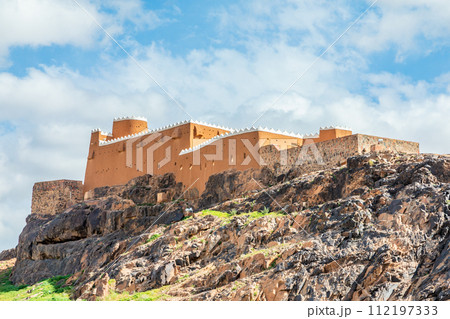 Arabian Aarif fortress walls and towers standing on the hill, Hail, Saudi Arabia Arabian Aarif fortress walls and towers standing on the hill, Hail, Saudi Arabia 112197333