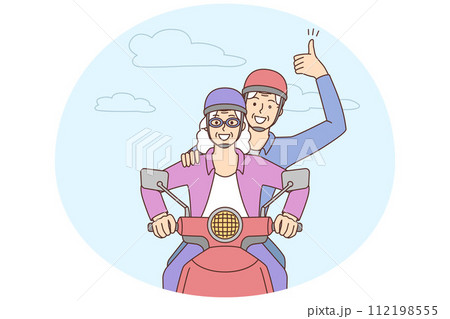 Smiling mature couple driving motorbike 112198555