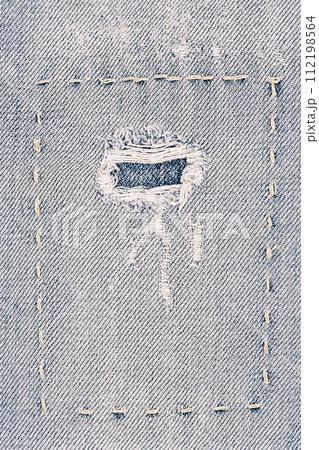 Denim fabric as a background. Macro photo of an item of clothing, jeans with a patch. 112198564