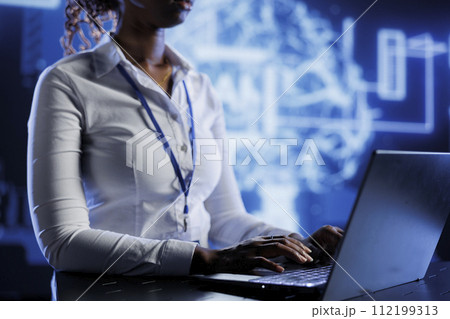 Certified technician developing artificial intelligence neural networks nodes modeled after human brain. Experienced worker setting up AI machine learning accurately making predictions using data 112199313