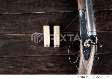 12 gauge break action smooth bored shotgun with paper cartridges. 112200082