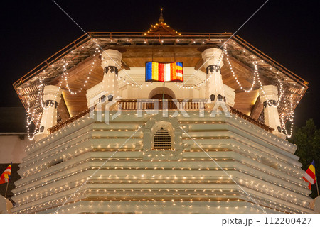 Night view of the octagonal pavilion named Paththirippuwa in Temple of the Sacred Tooth Relic a Buddhist temple in the city of Kandy, Sri Lanka. Night view of the octagonal pavilion named Paththirippuwa in Temple of the Sacred Tooth Relic a Buddhist temple in the city of Kandy, Sri Lanka. 112200427