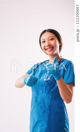 Healthcare advertising woman uniform thumbs up Healthcare advertising woman uniform thumbs up 112200667