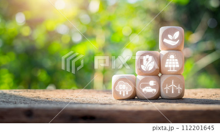 Green energy concept, Wooden block on desk with green energy icon on virtual screen. 112201645
