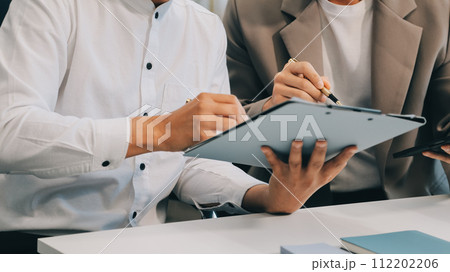 Business team working with new startup project plan and discussion information for financial strategy with laptop and digital tablet in a modern business lounge. 112202206