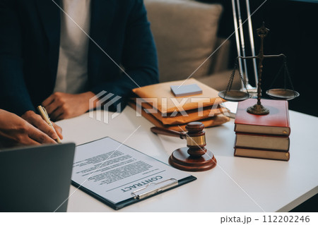 Consultation and conference of Male lawyers and professional businesswoman working and discussion having at law firm in office. Concepts of law, Judge gavel with scales of justice. 112202246