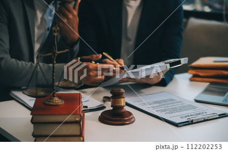 Consultation and conference of Male lawyers and professional businesswoman working and discussion having at law firm in office. Concepts of law, Judge gavel with scales of justice. 112202253