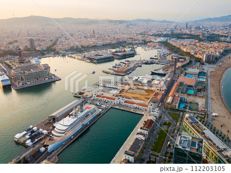 Aerial view from drones of old port in Barcelona with of sailboats and yachts Aerial view from drones of old port in Barcelona with of sailboats and yachts 112203105