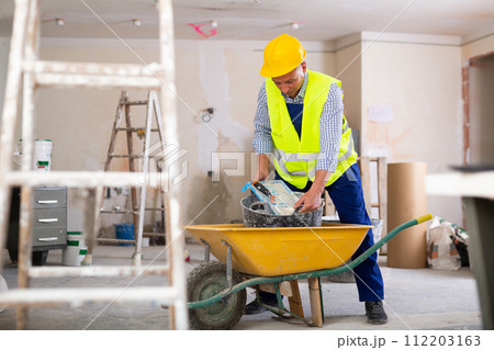 Man builder working in construction site Man builder working in construction site 112203163
