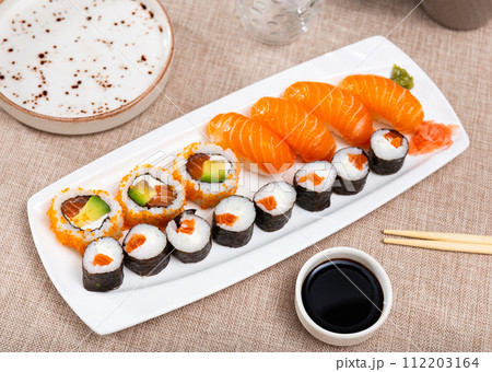 On table there portion set with maki - uramaki and nigiri On table there portion set with maki - uramaki and nigiri 112203164