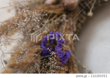 wreath of dried herbs Poppy spikelets of wheat predominance of blue dried herbs in decoration on the wall we will weave a wreath With love, handmade art Dried wildflowers create the atmosphere. wreath of dried herbs Poppy spikelets of wheat predominance of blue dried herbs in decoration on the wall we will weave a wreath With love, handmade art Dried wildflowers create the atmosphere. 112203351