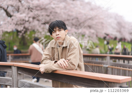 Portrait traveler asian man travel in japan spring sakura season 112203369