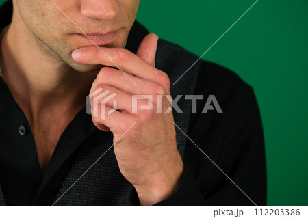 Businessman looking to the side in contemplation. 112203386