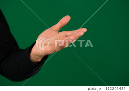 Hand men isolated on green background 112203423