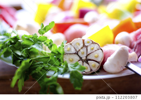 Raw meat skewers with vegetables on wooden background 112203807