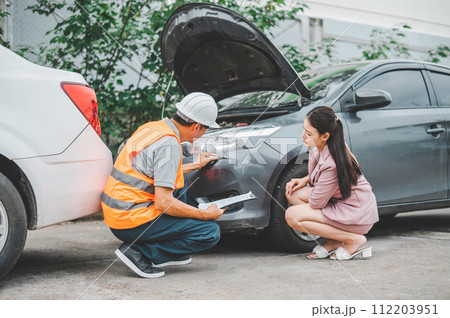 male insurance officer came to help inspect a customer's car that had an accident. Concept for vehicle crash, insurance claim. 112203951
