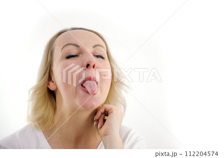 Girl doing a joke over isolated white background 112204574