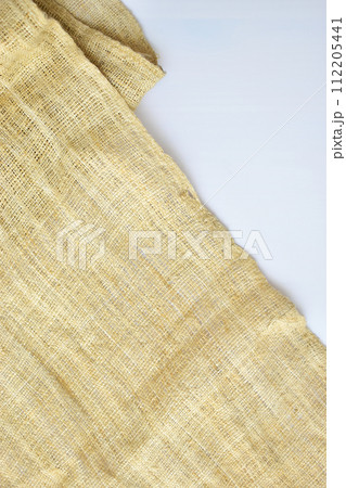 torn sackcloth isolated on white background, burlap fabric texture for design 112205441
