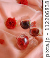 wine and glass with roses background                 112206838