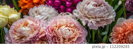 Multicolored pions in a flower shop - fresh supply of cut flowers for spring holidays, floral shop. AI generated 112209285