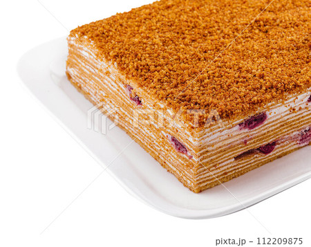 honey cake on plate isolated on white 112209875
