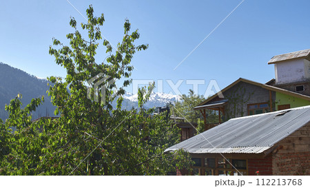 A vast landscape with clear skies, clouds, and snowy mountains. A vast landscape with clear skies, clouds, and snowy mountains. 112213768