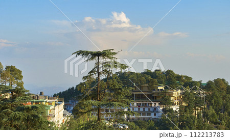 A vast landscape with clear skies, clouds, and snowy mountains. A vast landscape with clear skies, clouds, and snowy mountains. 112213783