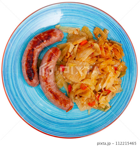 Roasted tasty sausages served with side dish of cabbage stewed 112215465