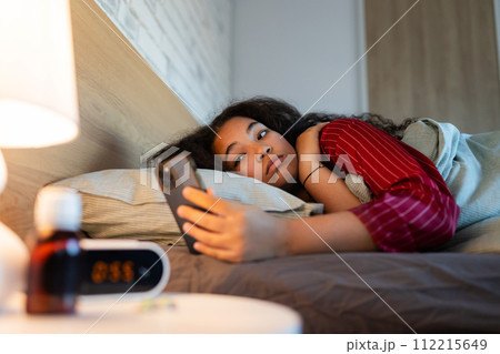 Woman can't fall asleep, insomnia a sleep problems. Concept of sleep routine and techniques for better sleep. World Sleep Day. Woman can't fall asleep, insomnia a sleep problems. Concept of sleep routine and techniques for better sleep. World Sleep Day. 112215649