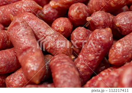 Smoked sausages on a meat market counter Smoked sausages on a meat market counter 112217411