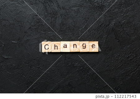 CHANGE word written on wood block. CHANGE text on cement table for your desing, concept CHANGE word written on wood block. CHANGE text on cement table for your desing, concept 112217543