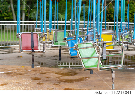 Colorful swing ride at the amusement park 112218041