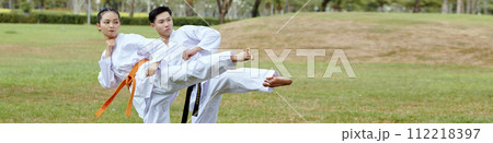 Header with taekwondo athletes doing side kick 112218397