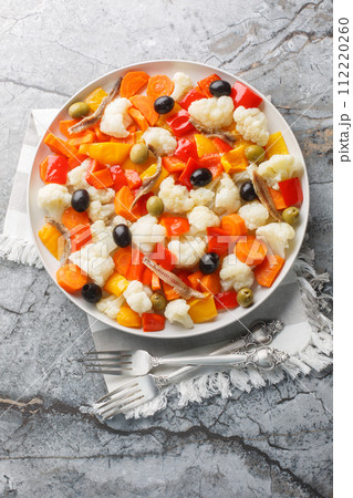 Insalata Di Rinforzo Italian classic the Neapolitan Christmas cauliflower salad closeup on the plate. Vertical top view 112220260