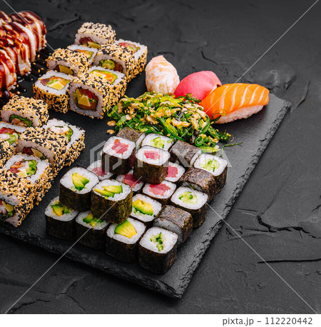 Sushi set on black stone background 112220442